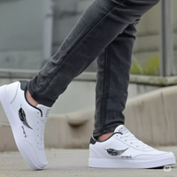 White Sneakers – Stylish Comfort with Black Feather Design